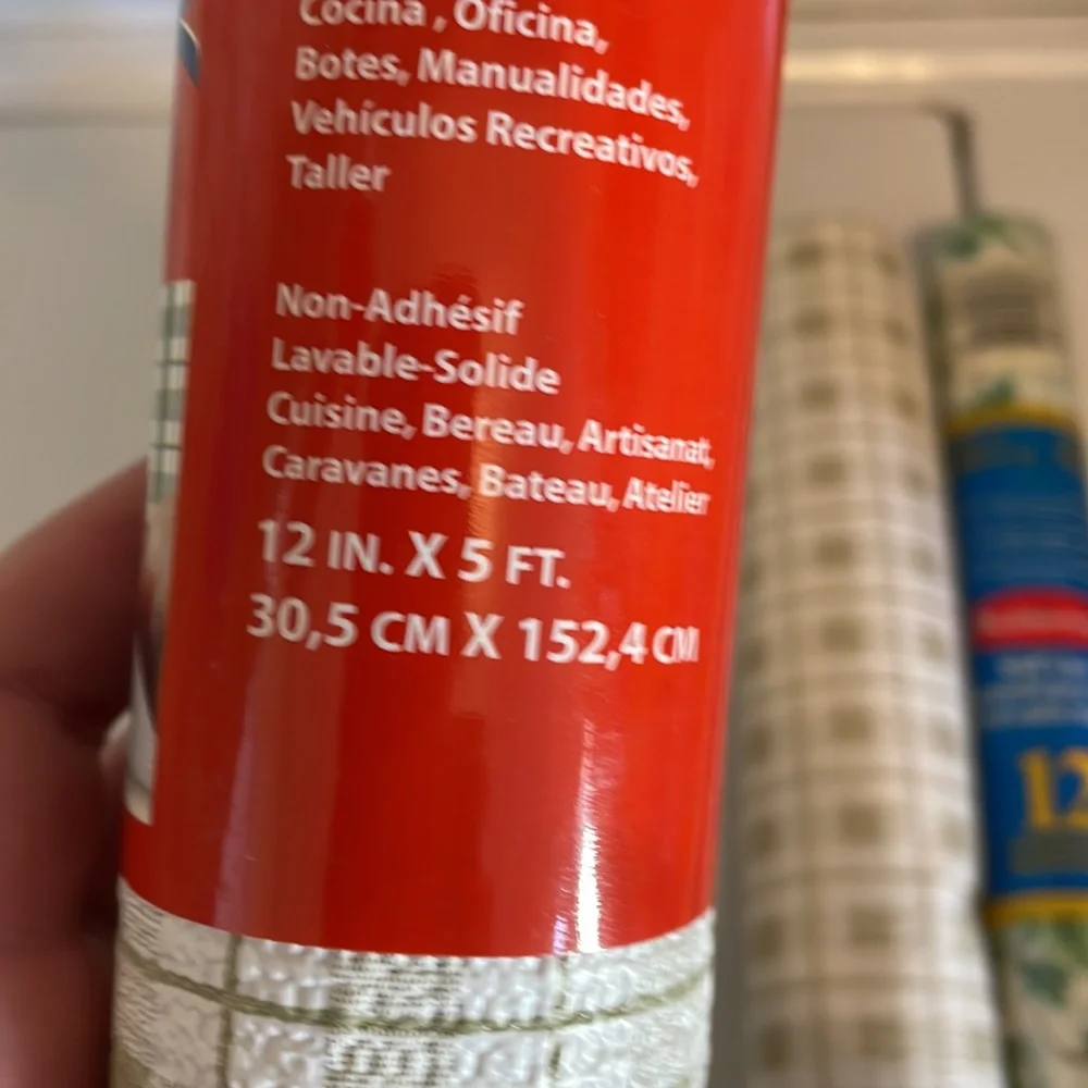 Five rolls of Rubbermaid shelf liner, some adhesive some not 3 full new rolls